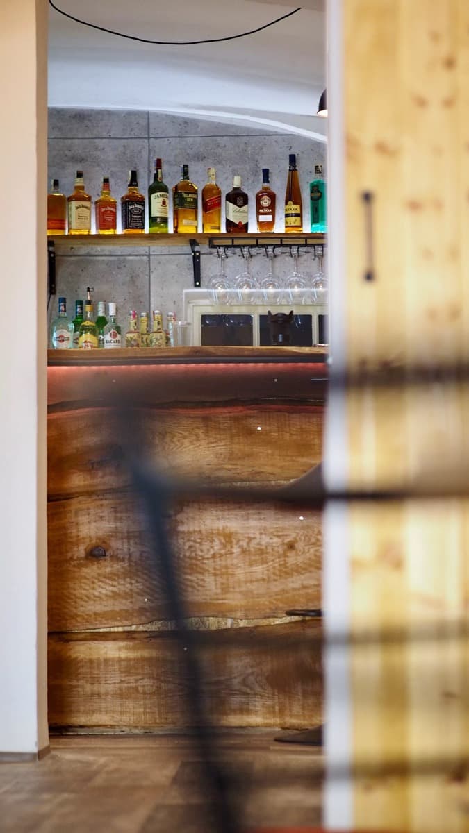 Bar shelf with bottles and glassware