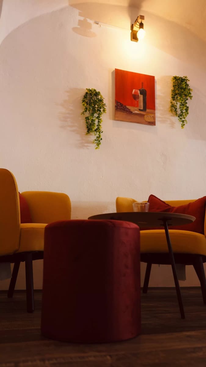 Cozy seating area with wine painting